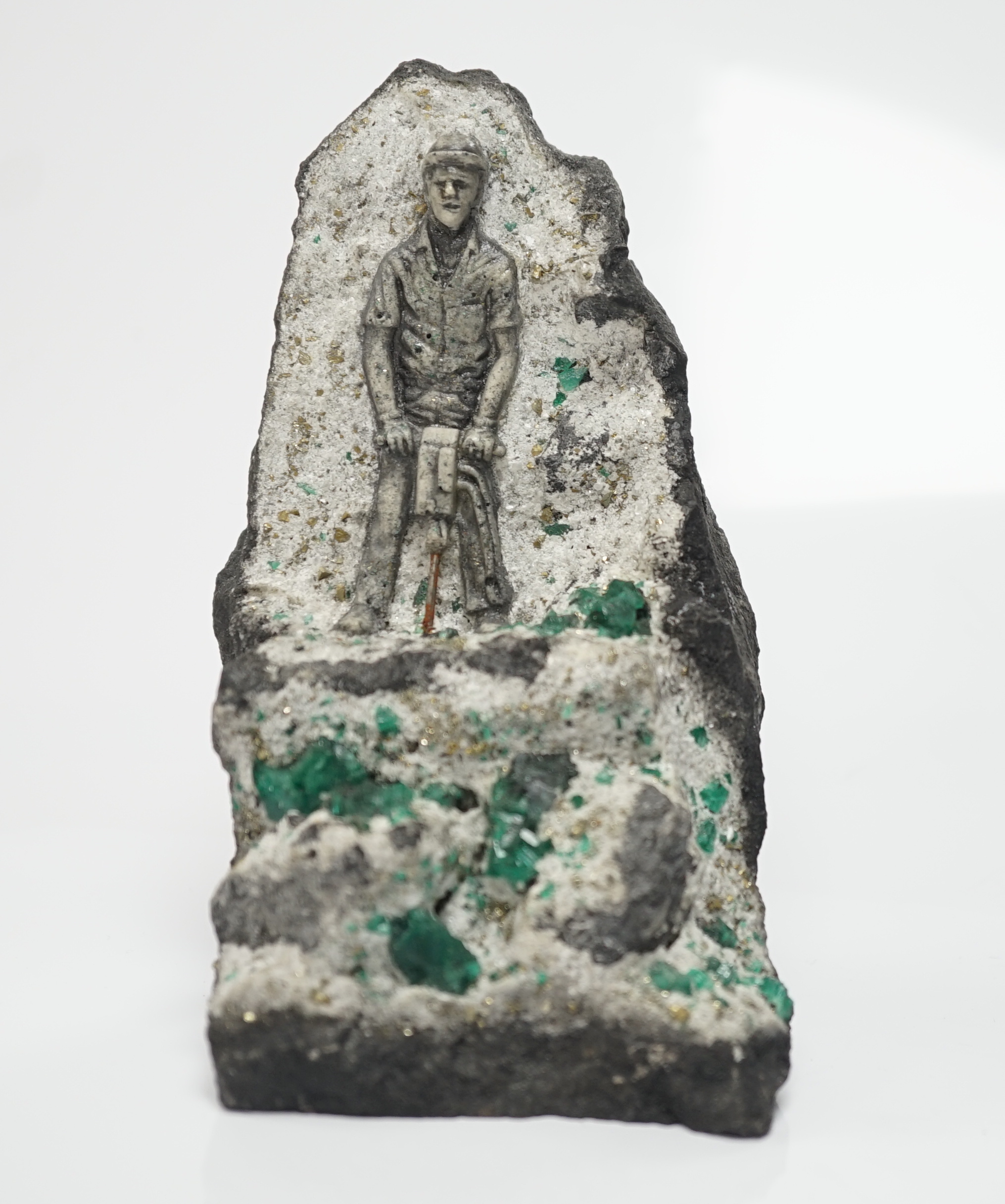 An iron pyrites and emerald? crystal figural geode sculpture, 14cm